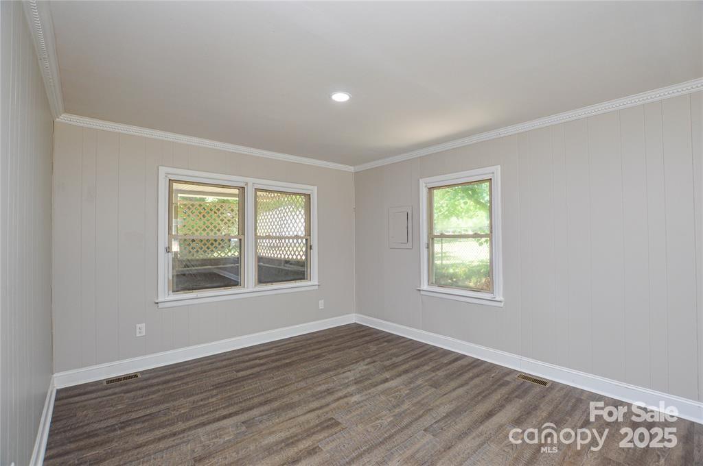 116 Brymer Road Gastonia, NC 28056 - Photo 11 of 21 an empty room with wooden floor and windows