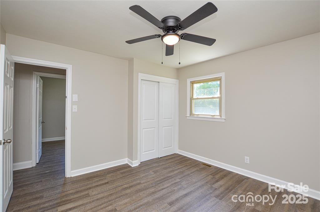 116 Brymer Road Gastonia, NC 28056 - Photo 14 of 21 a view of an empty room with wooden floor