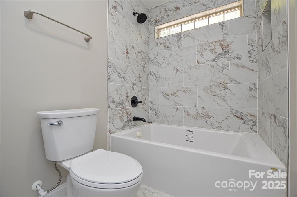 116 Brymer Road Gastonia, NC 28056 - Photo 16 of 21 a white bath tub sitting next to a white toilet
