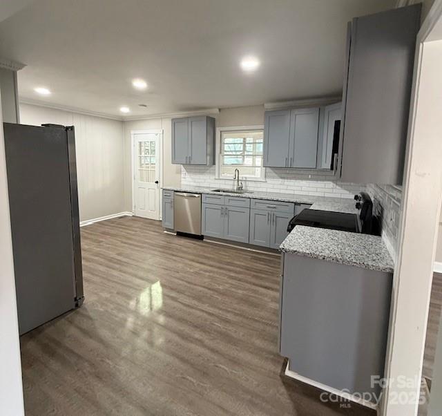 116 Brymer Road Gastonia, NC 28056 - Photo 9 of 21 a kitchen with granite countertop a refrigerator a sink dishwasher and a stove with wooden floor