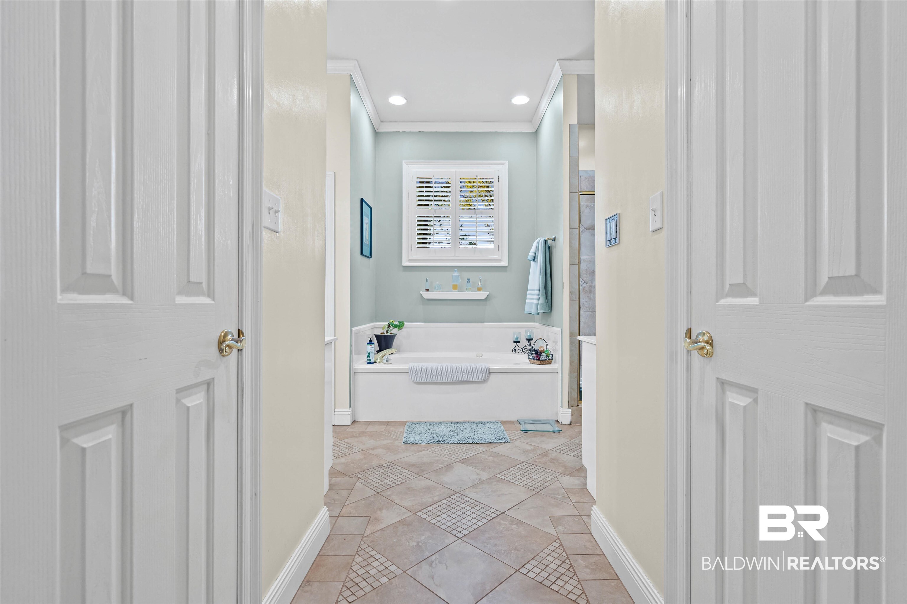 107 Beaver Dam Road Fairhope, AL 36532 - Photo 19 of 45 Bathroom featuring a garden tub, ornamental molding, light tile patterned floors, and recessed lighting