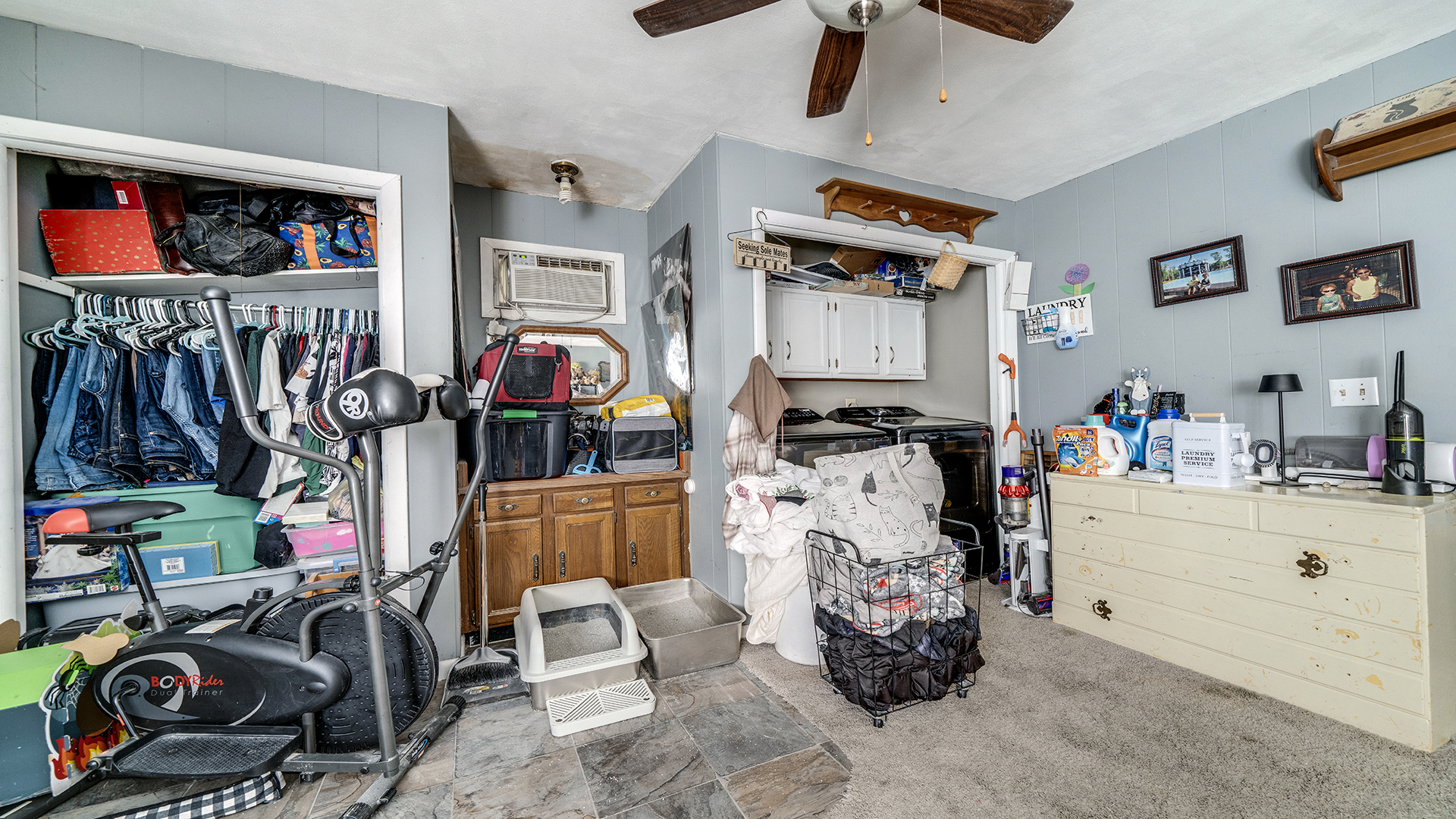 128 West 2nd Street Byron, IL 61010 - Photo 12 of 48 a view of walk in closet with clothes and shoes