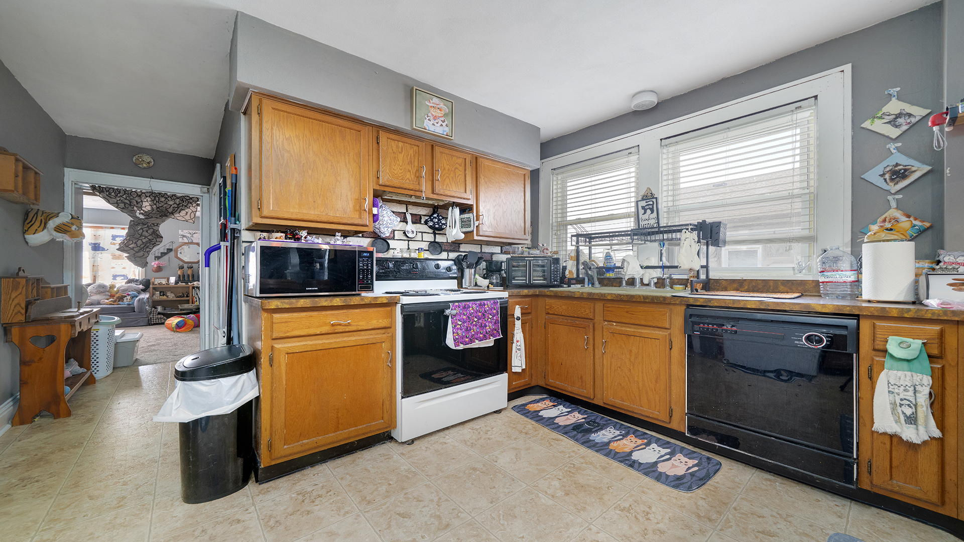 128 West 2nd Street Byron, IL 61010 - Photo 16 of 48 a kitchen with stainless steel appliances kitchen island granite countertop a stove a sink and a refrigerator