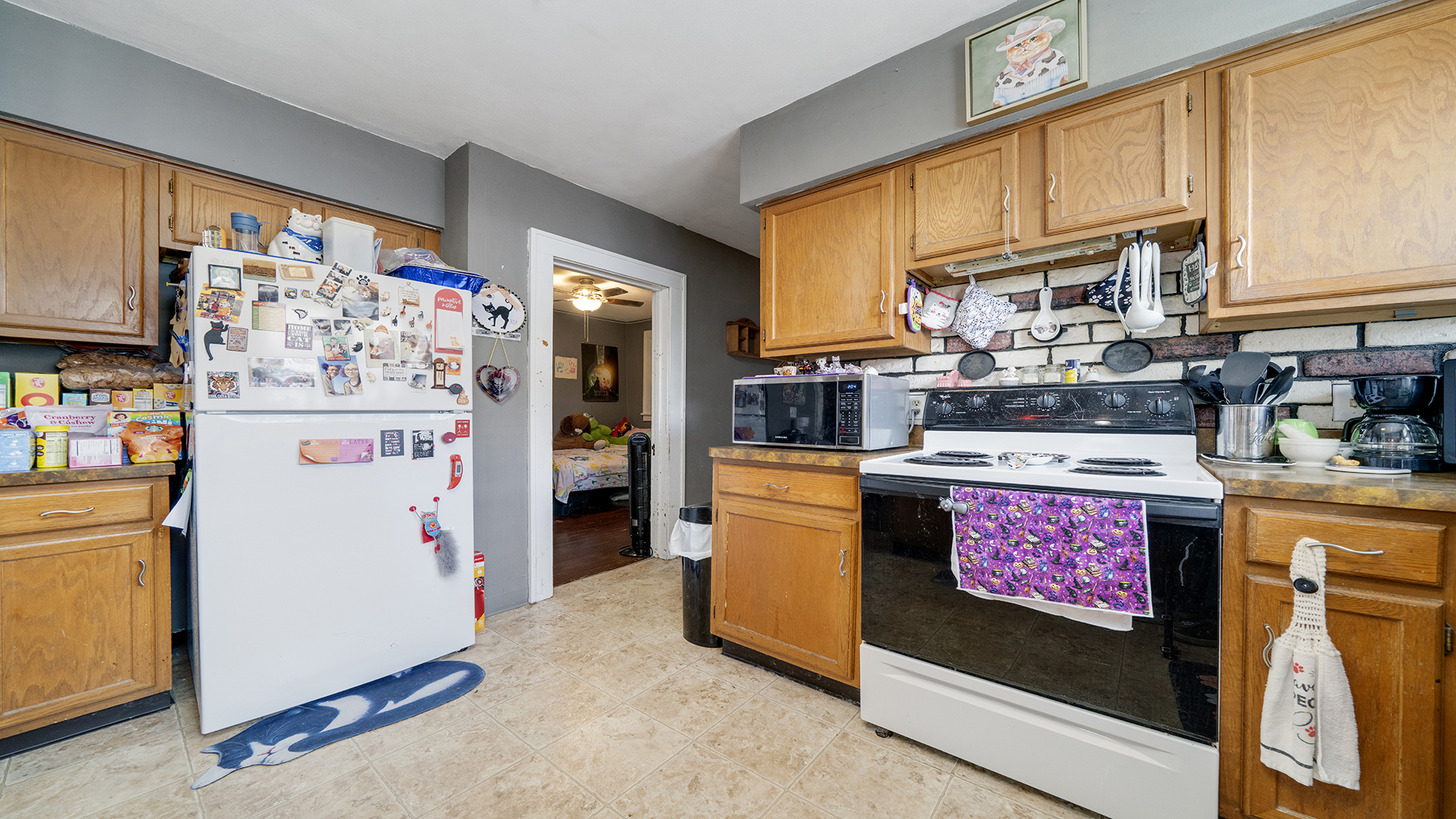 128 West 2nd Street Byron, IL 61010 - Photo 17 of 48 a kitchen with stainless steel appliances granite countertop a refrigerator a stove a sink a counter space and cabinets