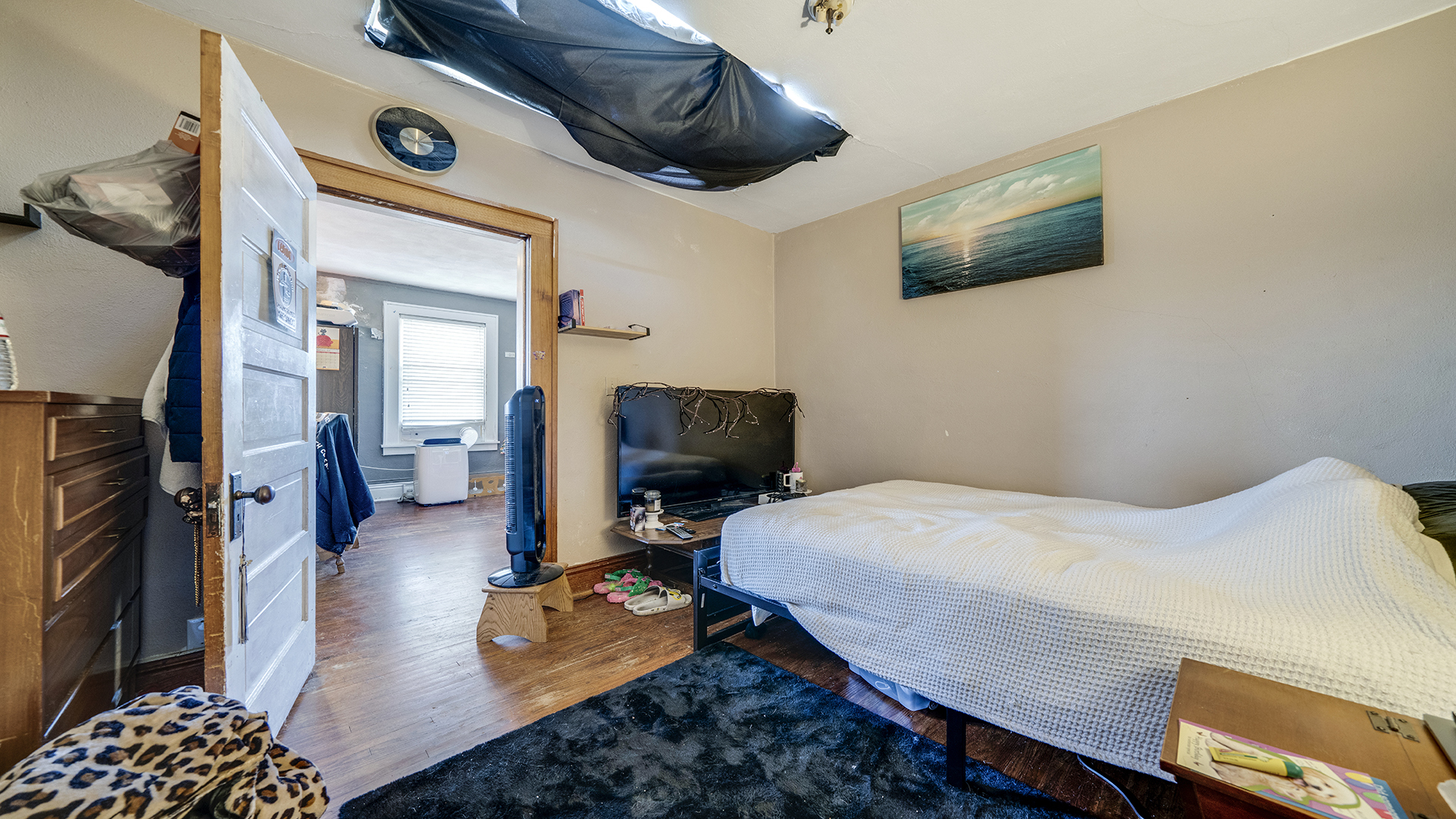 128 West 2nd Street Byron, IL 61010 - Photo 19 of 48 a bedroom with a bed and a chandelier