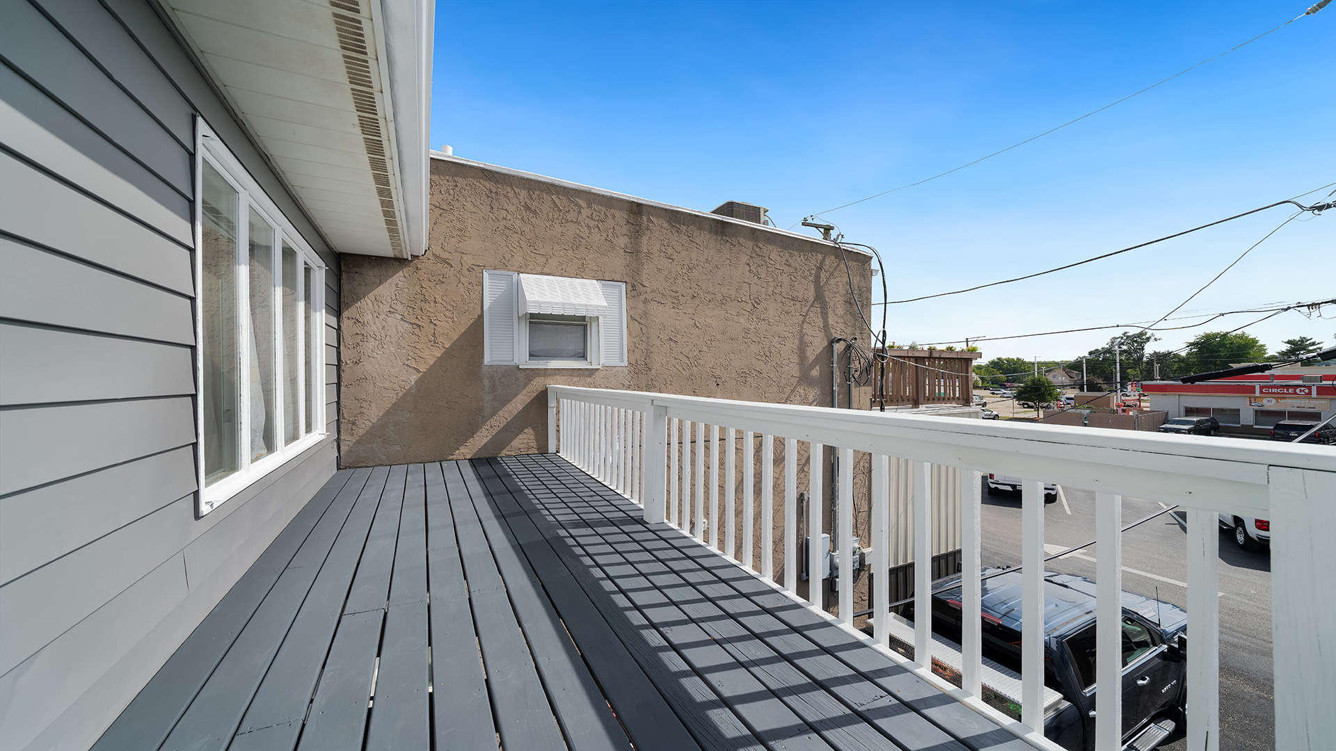 128 West 2nd Street Byron, IL 61010 - Photo 25 of 48 a view of balcony with wooden floor