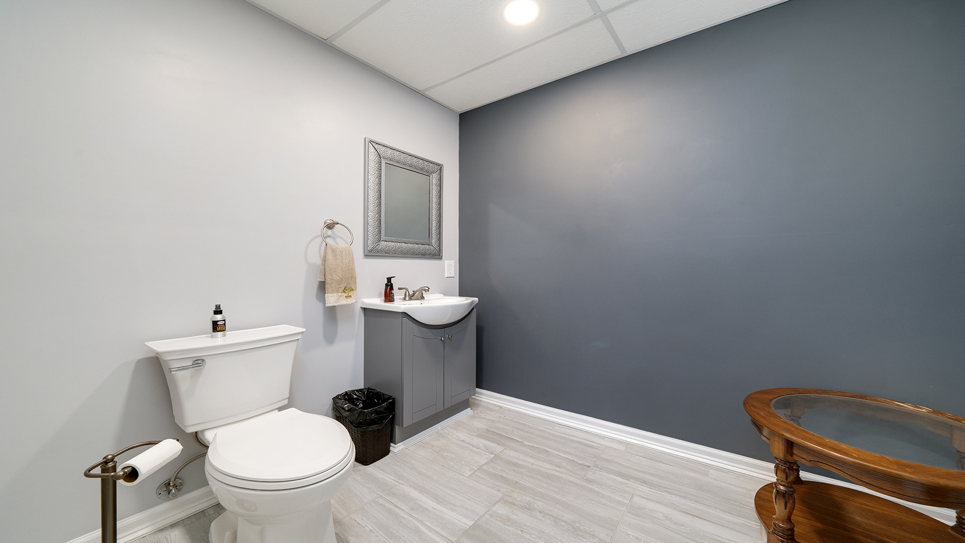 128 West 2nd Street Byron, IL 61010 - Photo 36 of 48 a bathroom with a toilet a sink and mirror