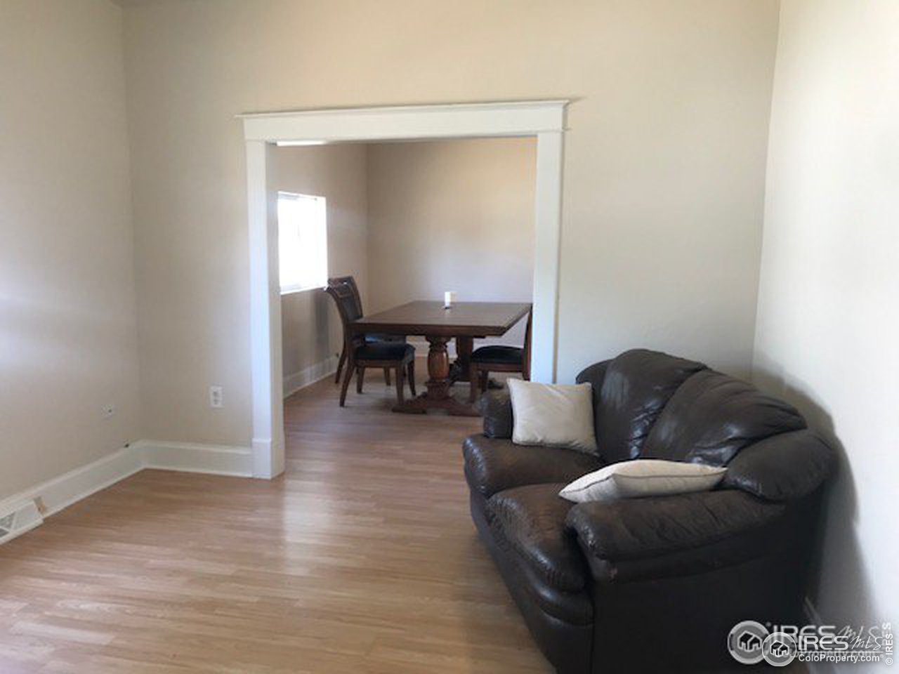 316 Walnut Street Fort Morgan, CO 80701 - Photo 11 of 22 a living room with furniture and a dining table