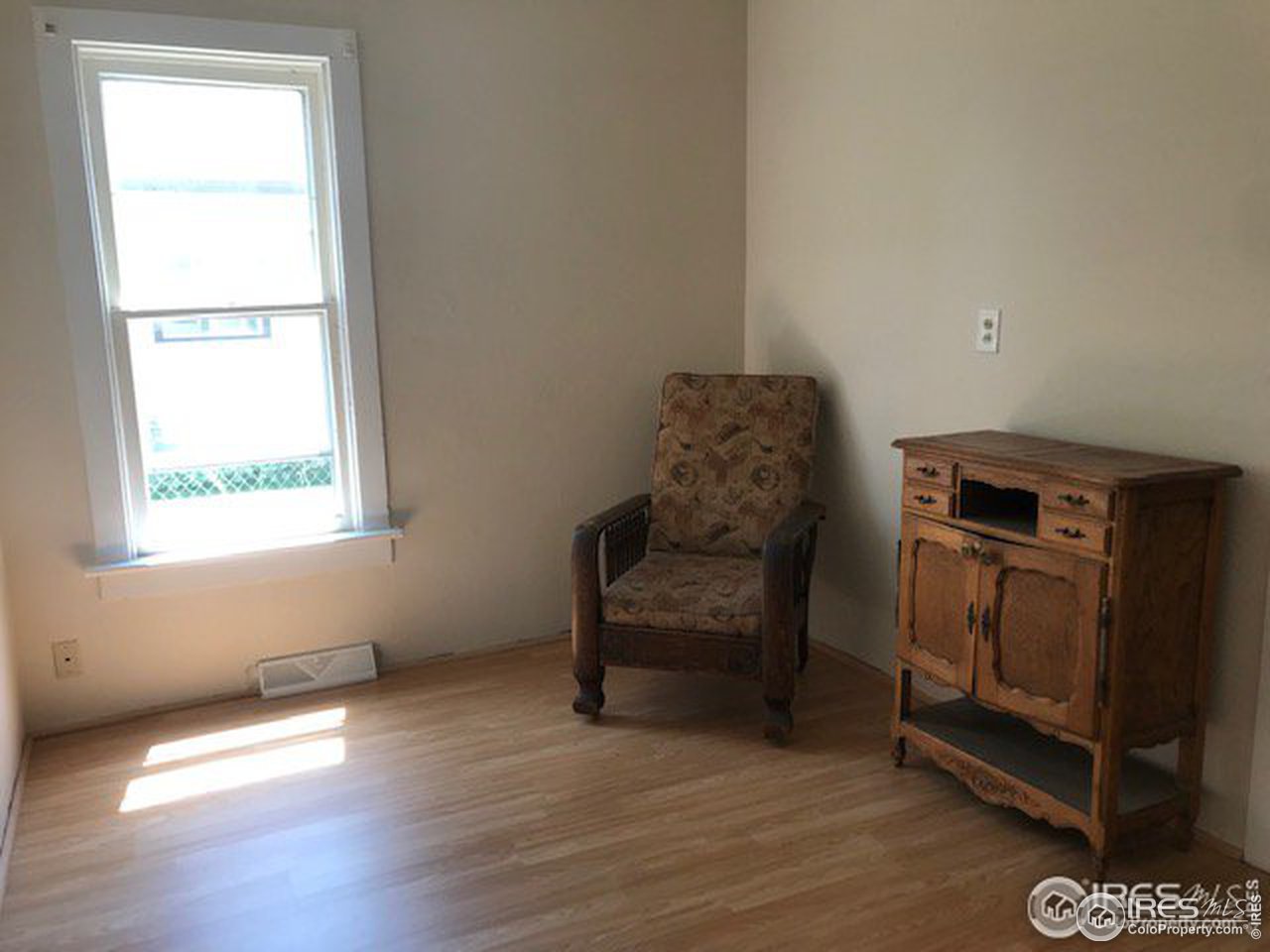 316 Walnut Street Fort Morgan, CO 80701 - Photo 13 of 22 a living room with furniture and a window