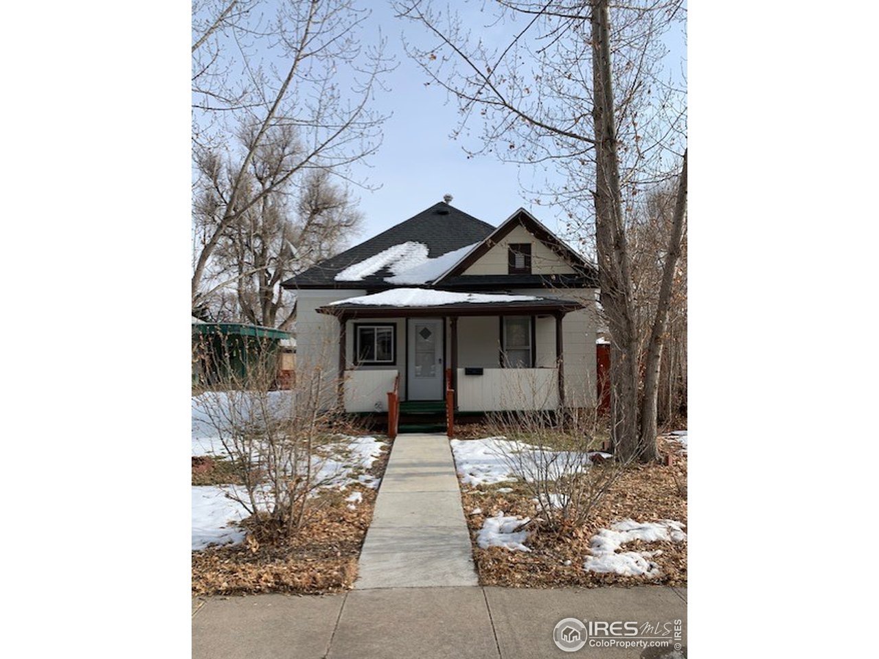 316 Walnut Street Fort Morgan, CO 80701 - Photo 16 of 22 a front view of a house with yard