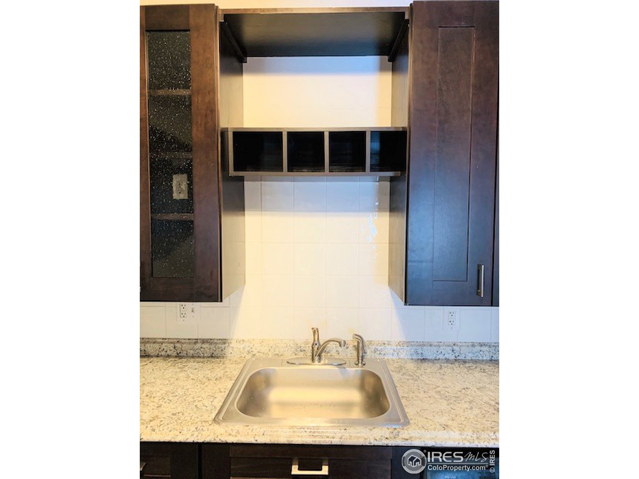 316 Walnut Street Fort Morgan, CO 80701 - Photo 4 of 22 a bathroom with a sink and a mirror