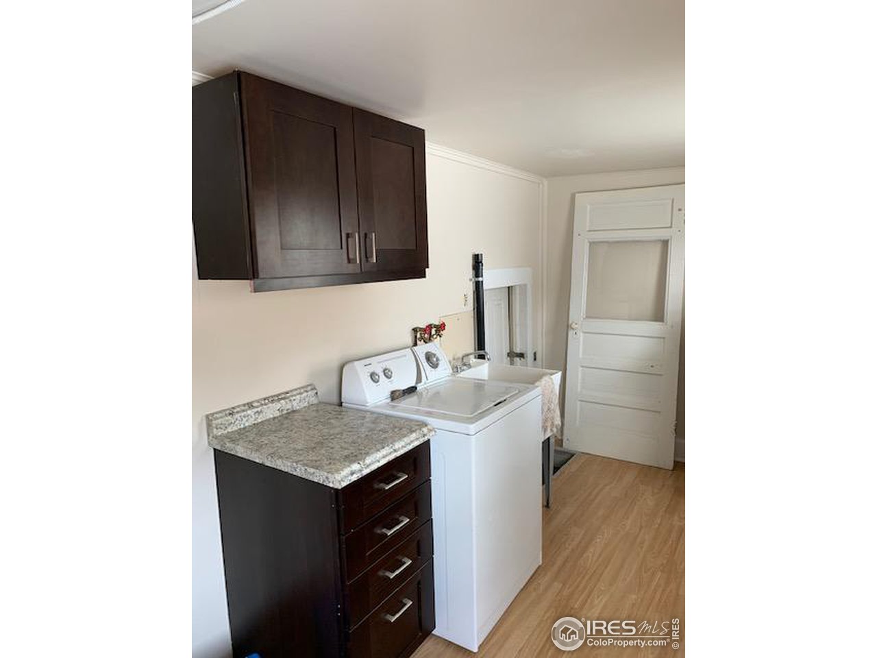 316 Walnut Street Fort Morgan, CO 80701 - Photo 8 of 22 a utility room with sink dryer and washer