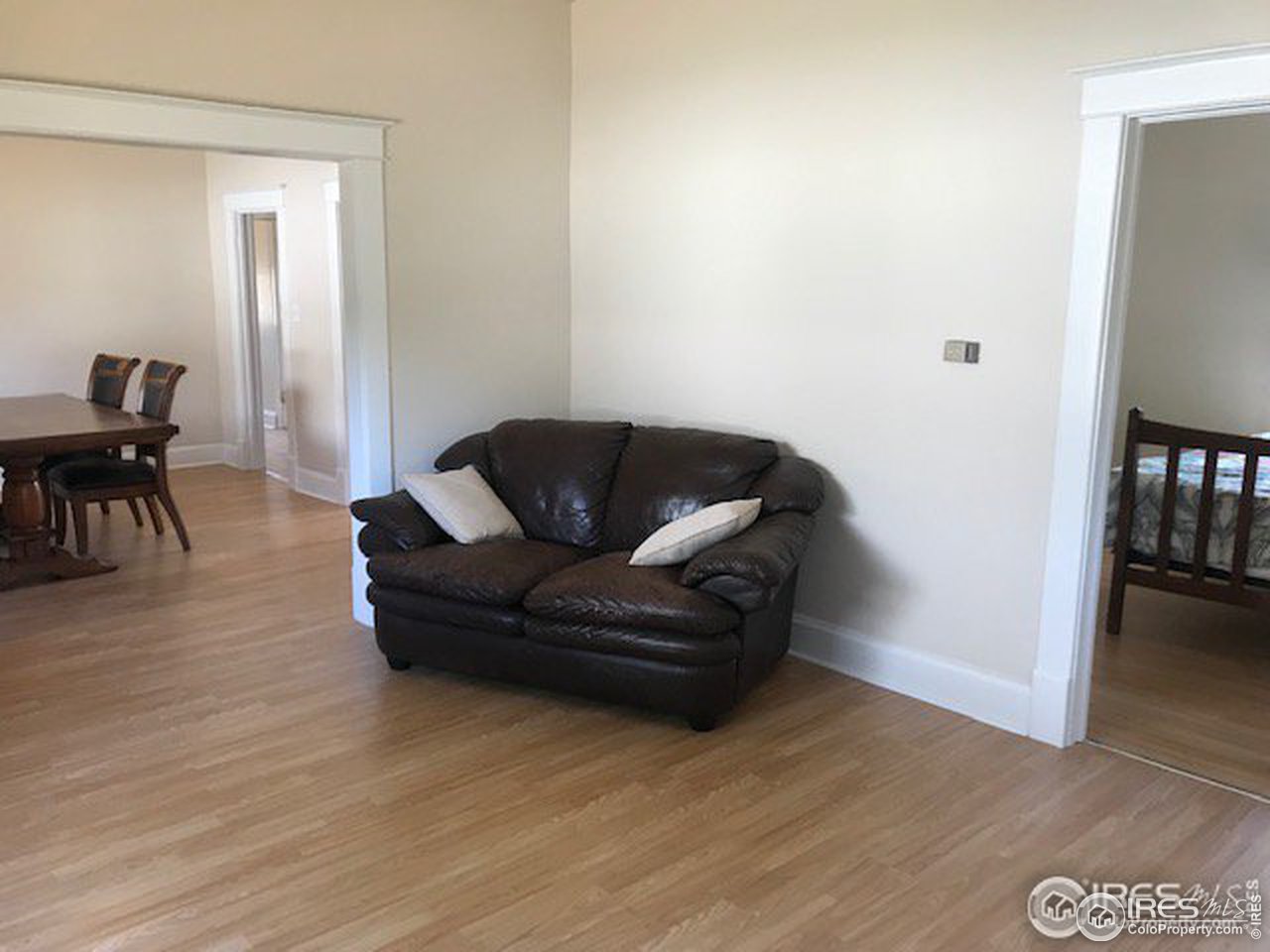 316 Walnut Street Fort Morgan, CO 80701 - Photo 10 of 22 a living room with furniture and a wooden floor