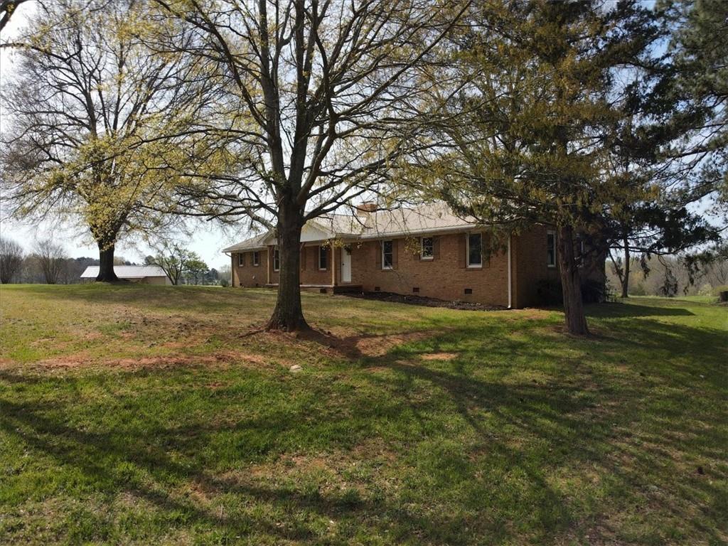 4164 Highway 198 Carnesville, GA 30521 - Photo 1 of 1 a view of a house with a yard