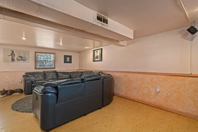 a kitchen with stainless steel appliances granite countertop a sink and a refrigerator