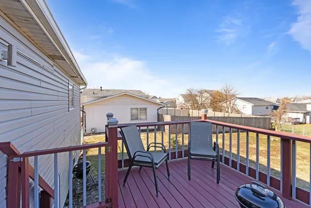 a view of a balcony with furniture