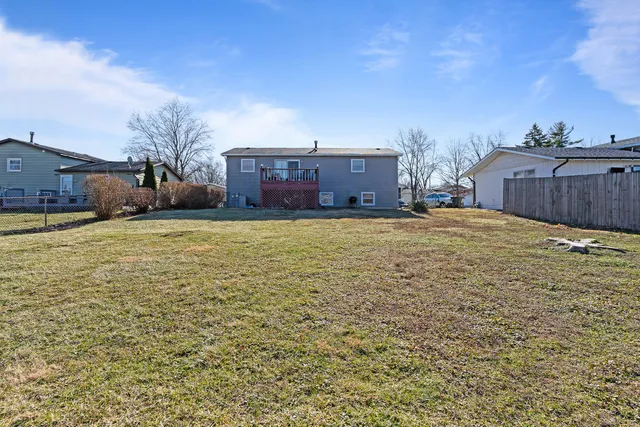 a view of a big room with table and chairs