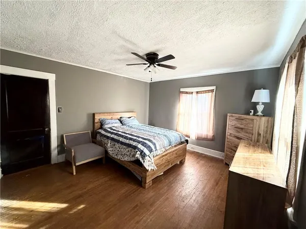 a bedroom with a bed and window