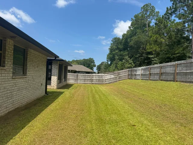 a view of a swimming pool with an outdoor seating