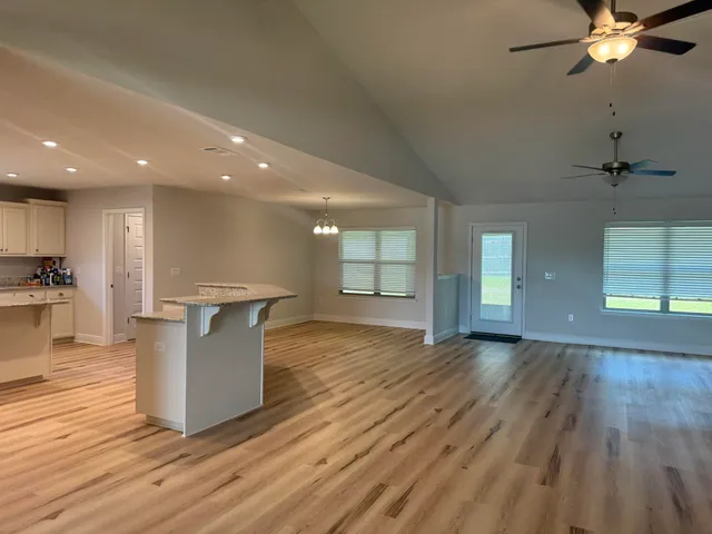 a view of kitchen with furniture and wooden floor