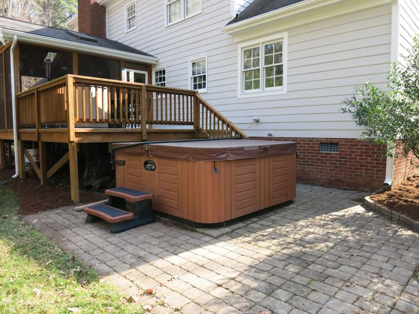 14008 Bingham Drive Raleigh, NC 27614 - Photo 26 of 30 The lg paver Patio w/hot tub is off the Deck. Patio