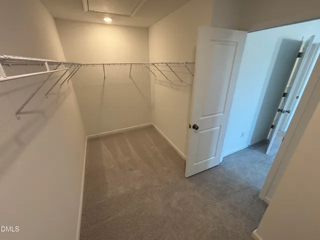 a bathroom with a double vanity sink mirror and shower