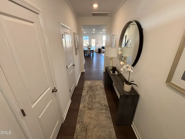 a kitchen with stainless steel appliances kitchen island granite countertop a stove a microwave a sink and cabinets