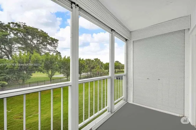 a view of a brick house with a yard and plants
