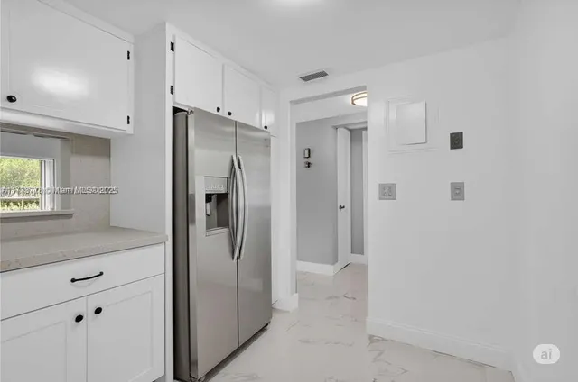 a bathroom with a shower and a glass door shower