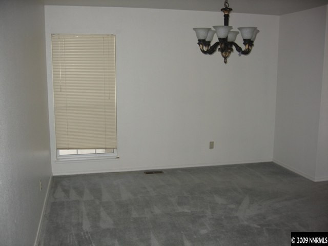 1275 High Chaparral Drive Reno, NV 89521 - Photo 4 of 9 an empty room with a window