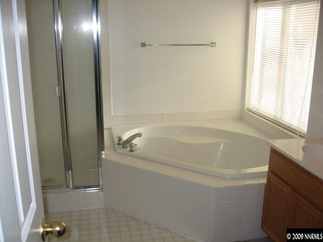 1275 High Chaparral Drive Reno, NV 89521 - Photo 7 of 9 a bathroom with a bathtub