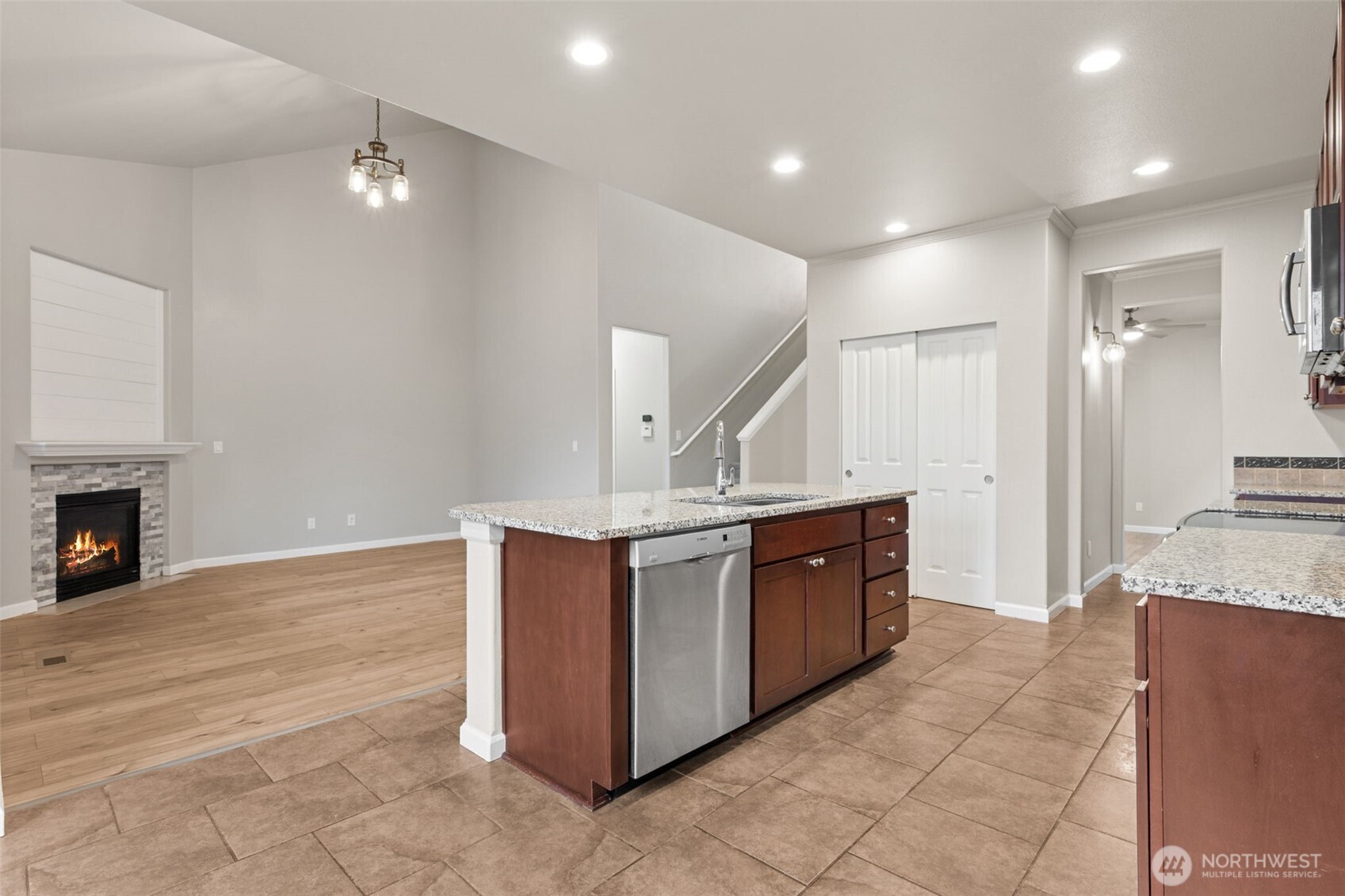 9248 Periwinkle Loop Northeast Olympia, WA 98516 - Photo 10 of 39 a large kitchen with stainless steel appliances a large counter top and a stove