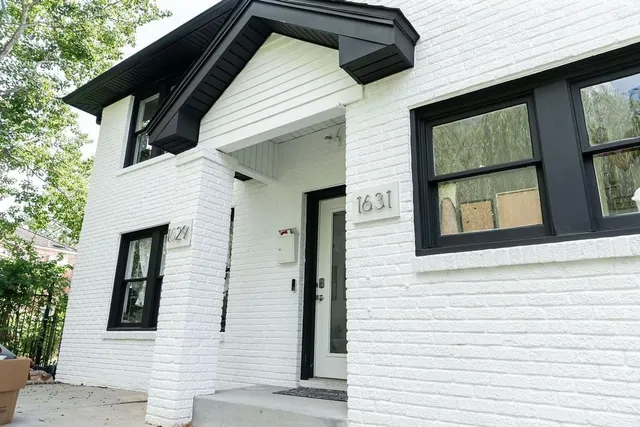 an empty room with wooden floor and closet