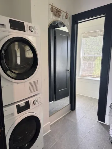 a view of a hallway with washer and dryer