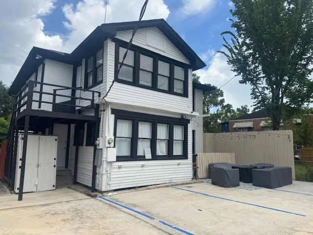 a view of a patio in the backyard