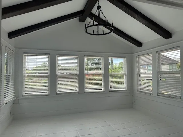 a view of a room with windows and stairs