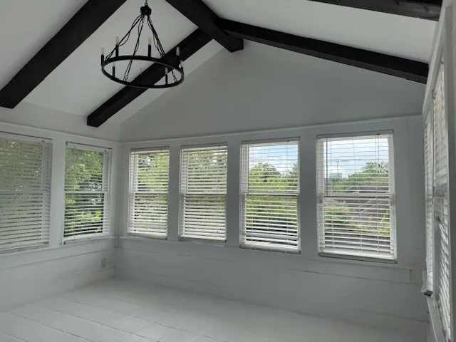 a kitchen with granite countertop a stove and a microwave