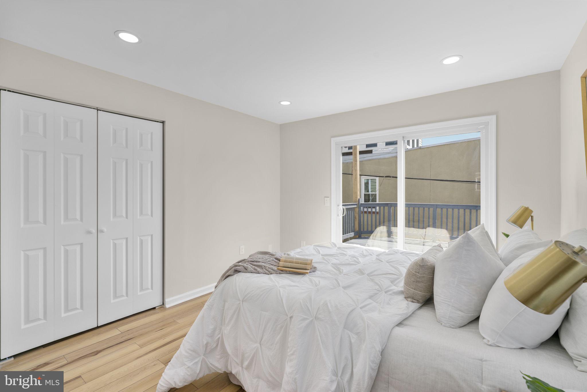 3111 Foster Avenue Baltimore, MD 21224 - Photo 13 of 28 a bedroom with a bed and a large window