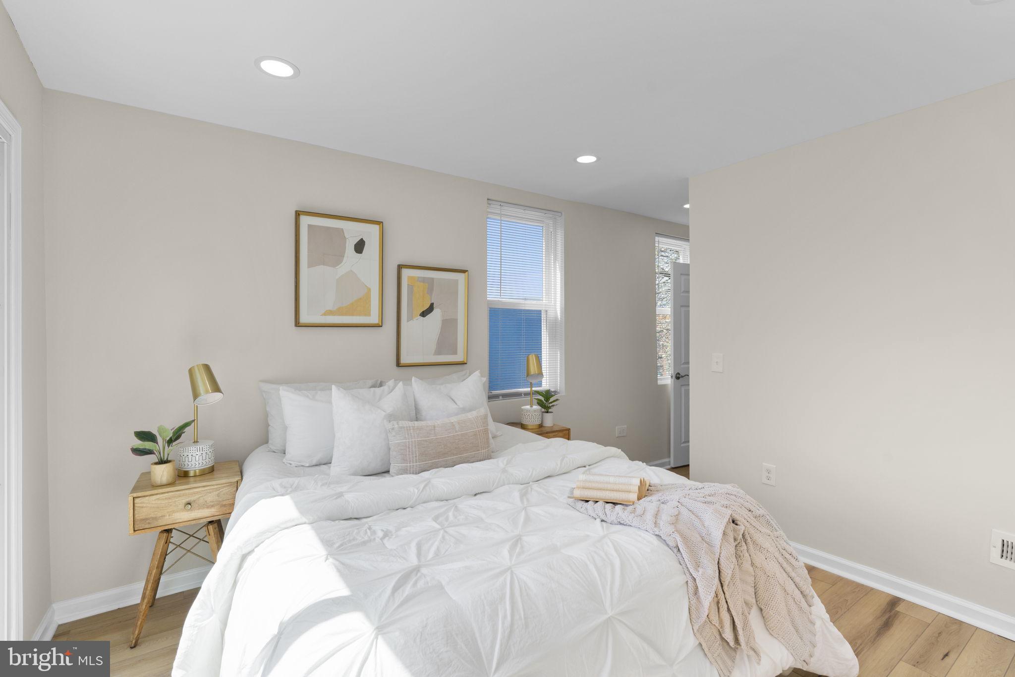 3111 Foster Avenue Baltimore, MD 21224 - Photo 14 of 28 a bedroom with a bed and painting on the wall