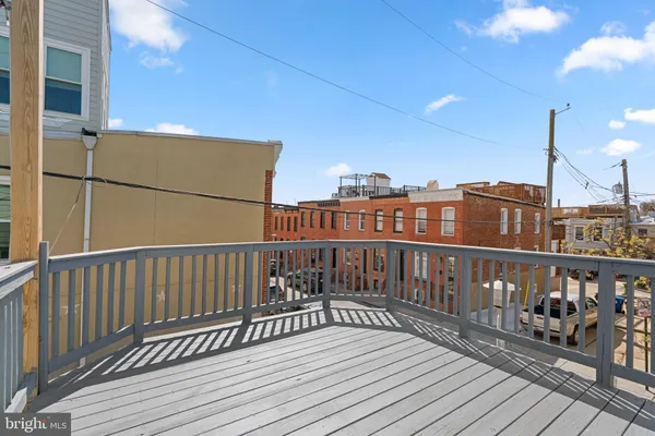 a view of balcony with wooden floor