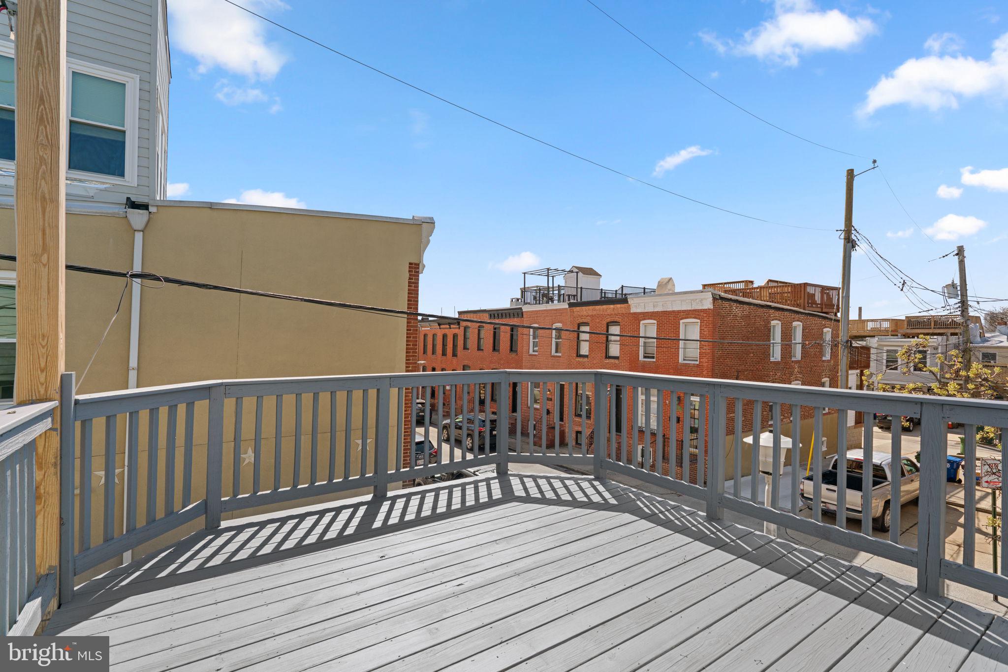 3111 Foster Avenue Baltimore, MD 21224 - Photo 21 of 28 a view of balcony with wooden floor