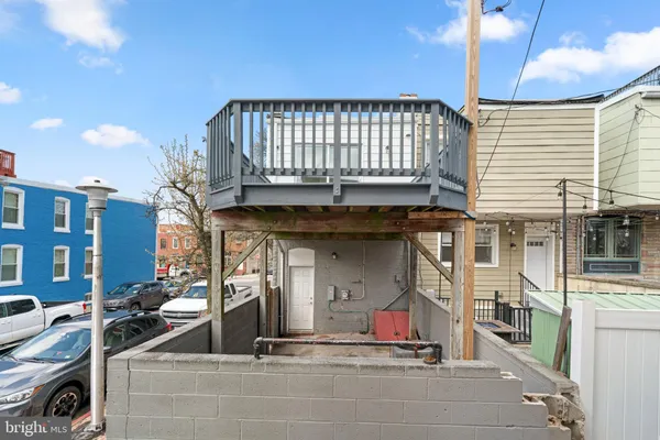 a view of a patio with a table and chairs