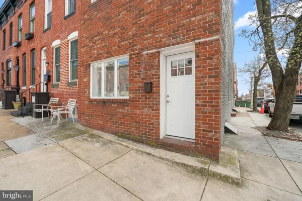 a view of a brick building with many windows