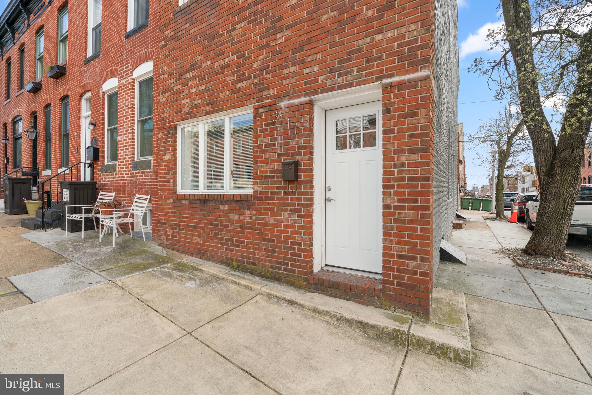 3111 Foster Avenue Baltimore, MD 21224 - Photo 27 of 28 a view of a brick building with many windows