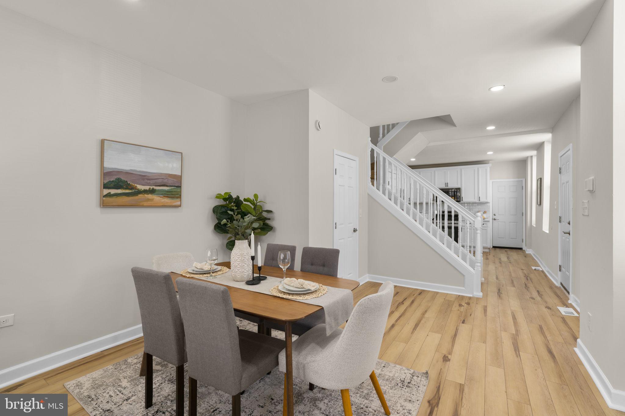 3111 Foster Avenue Baltimore, MD 21224 - Photo 3 of 28 a view of a dining room with furniture and wooden floor