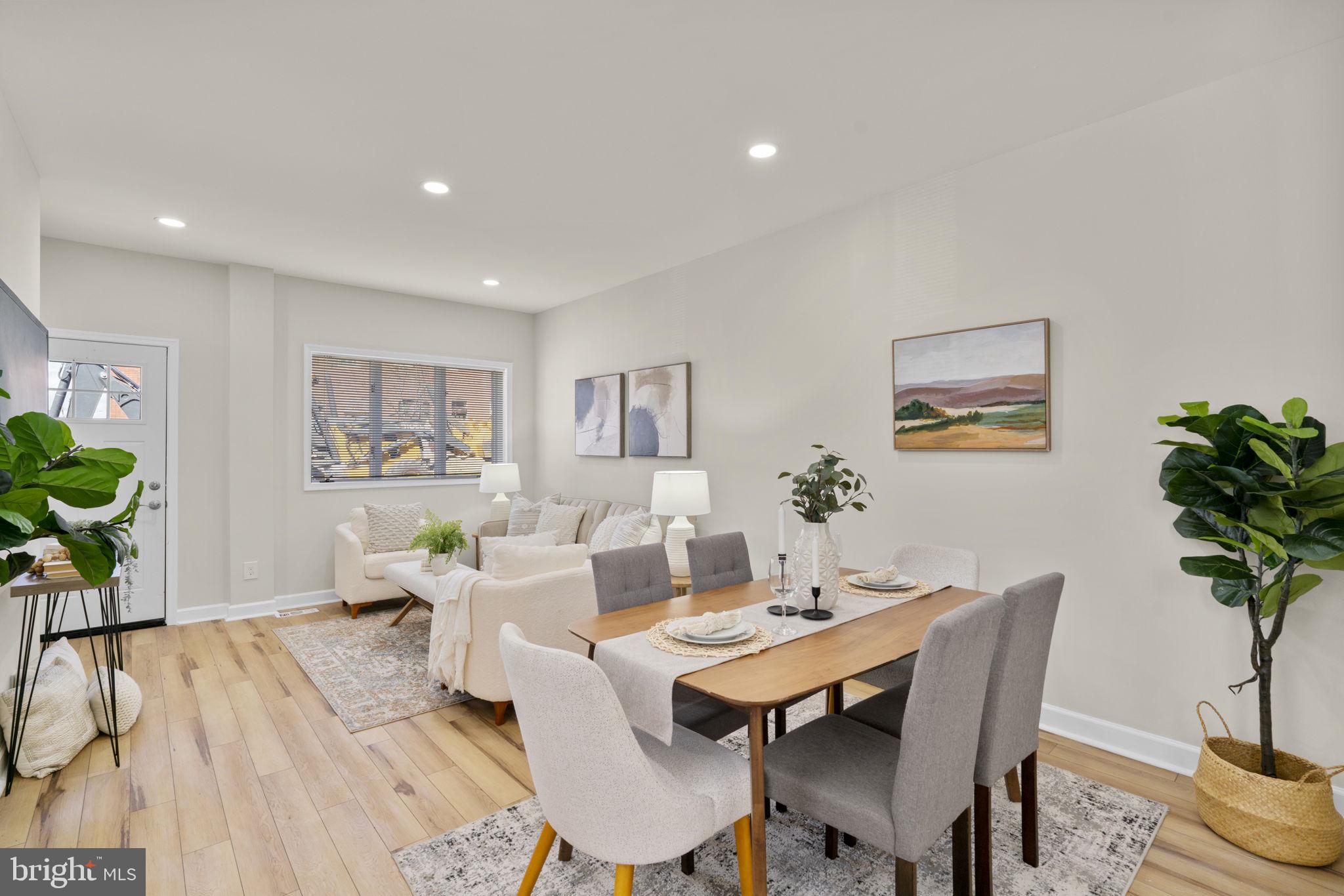3111 Foster Avenue Baltimore, MD 21224 - Photo 4 of 28 a view of a dining room with furniture window and wooden floor