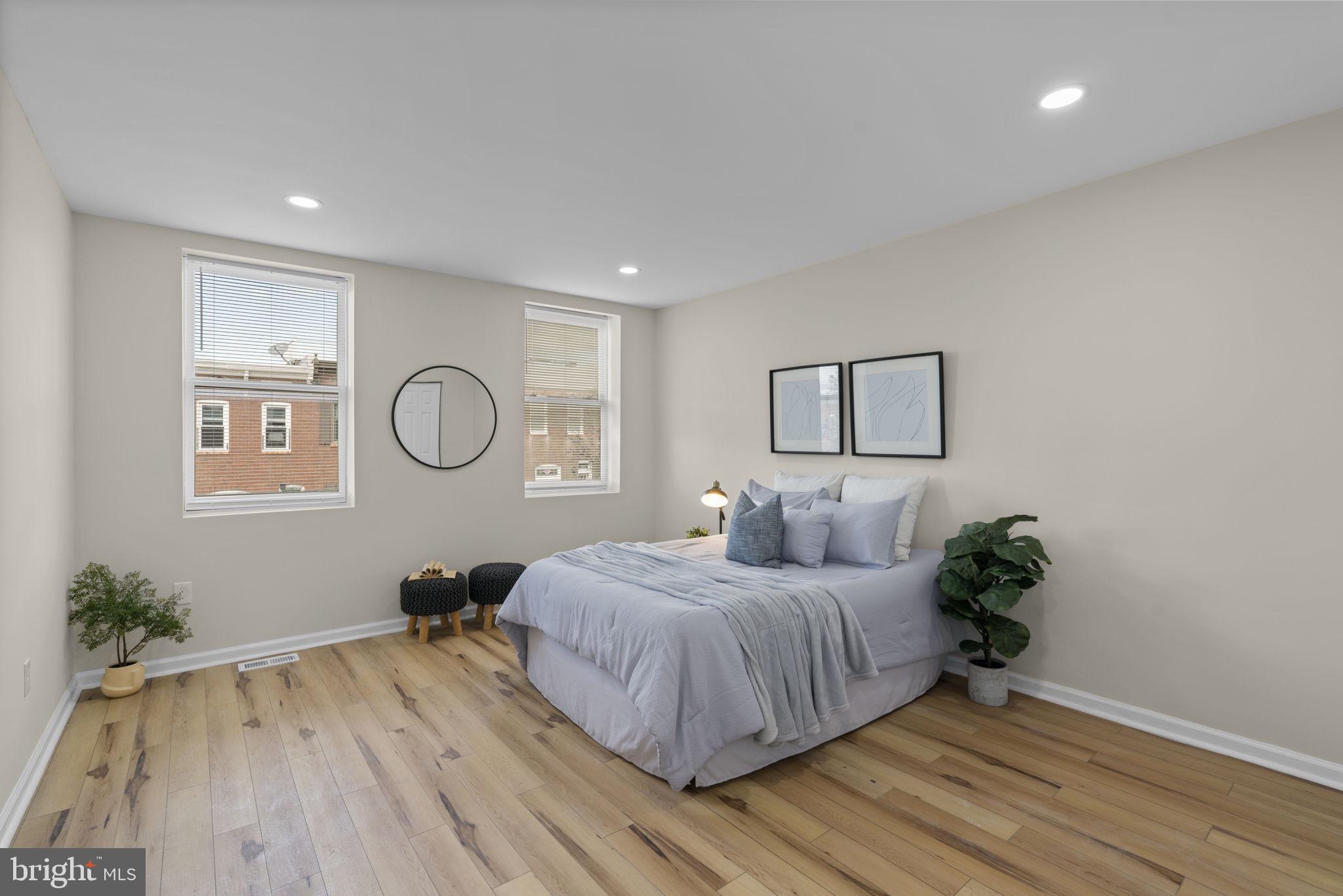 3111 Foster Avenue Baltimore, MD 21224 - Photo 9 of 28 a bedroom with a bed and a potted plant