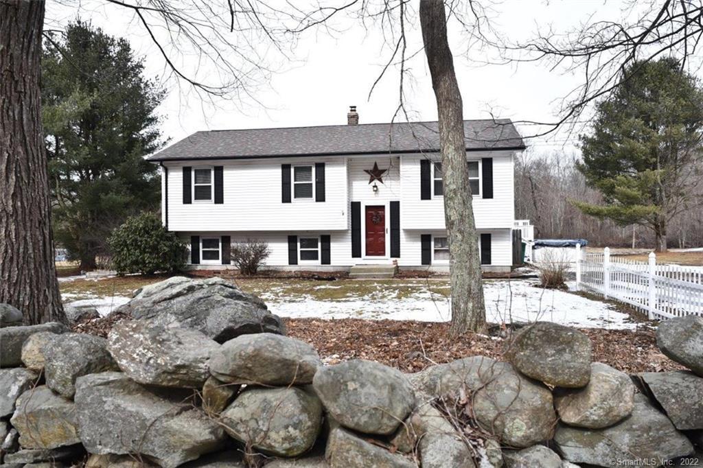 484 Kate Downing Road Plainfield, CT 06374 - Photo 1 of 1 a front view of a house with a yard covered in snow