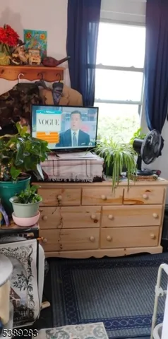 a view of room with wooden floor