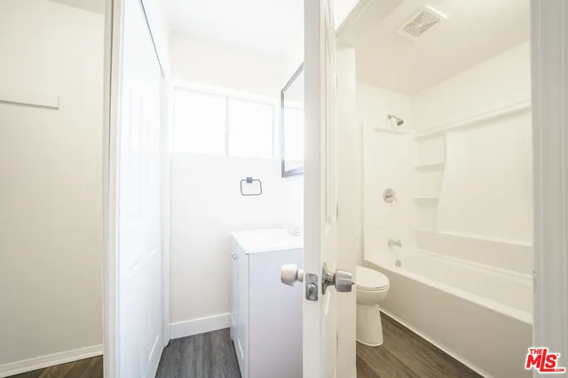 a bathroom with a bathtub and shower